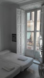 Ένα ή περισσότερα κρεβάτια σε δωμάτιο στο Pensión Duquesa Bed & Breakfast
