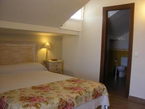 A bed or beds in a room at Albus Albi