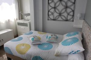 a bedroom with a bed with pillows on it at La Terrasse du Pecheur in Marseille