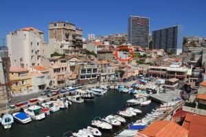 a group of boats are docked in a harbor at La Terrasse du Pecheur in Marseille