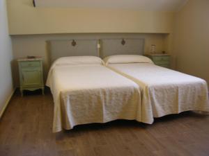 A bed or beds in a room at Albus Albi