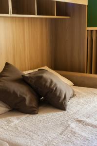 a pillow sitting on top of a bed at Casa Nocchi in Lucca