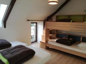 a bedroom with two bunk beds in a room at Camping Les Goélands in Ambon +51 photos