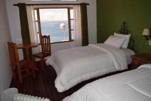 A bed or beds in a room at Wiñay Inti Lodge