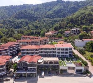 an aerial view of a resort with a mountain at Ntinas Filoxenia Hotel & Spa in Skala Potamias