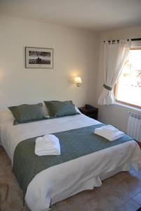 Кровать или кровати в номере Departamento de Alquiler Turistico