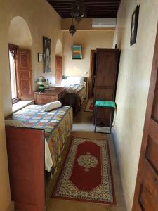 Postel nebo postele na pokoji v ubytování Riad Marlinea