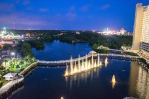 a view of a river at night with a fountain at Laketown Wharf Resort 416 By Aneliya in Panama City Beach