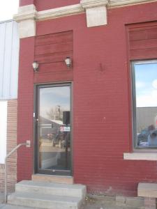 a red brick building with a glass door at The Westland Suite in Chester +6 photos