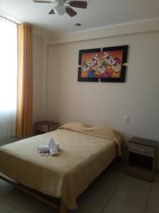 Voodi või voodid majutusasutuse Antares Paracas toas