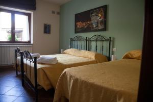 Posteľ alebo postele v izbe v ubytovaní La Carretteria Guest house