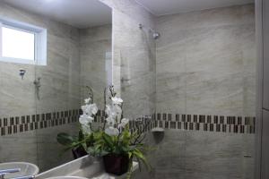 Koupelna v ubytování ARI Hotel