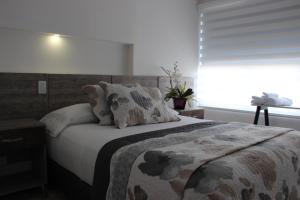 Postel nebo postele na pokoji v ubytování ARI Hotel