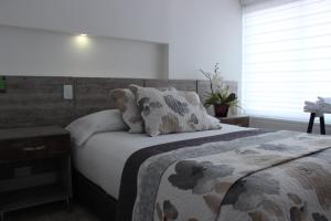 Postel nebo postele na pokoji v ubytování ARI Hotel