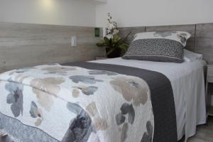 Postel nebo postele na pokoji v ubytování ARI Hotel