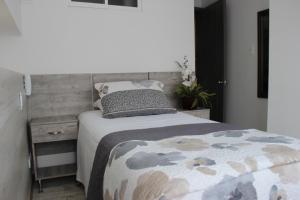 Postel nebo postele na pokoji v ubytování ARI Hotel