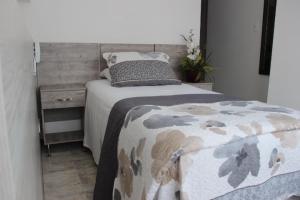 Postel nebo postele na pokoji v ubytování ARI Hotel