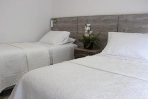 Postel nebo postele na pokoji v ubytování ARI Hotel