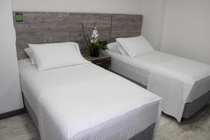 Postel nebo postele na pokoji v ubytování ARI Hotel