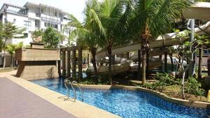 Photo de la galerie de l'établissement Cozy Swiss Garden Beach Resort Residence, à Kampung Sungai Karang