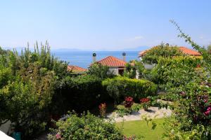 a garden with a view of the ocean at Beautiful Pelion Sea House in Kato Gatzea