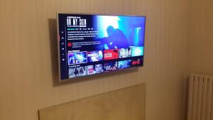 A television and/or entertainment centre at Residenza Porta Romana