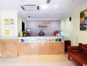 a sun inn restaurant with a sign on the wall at Sun Inns Hotel Sunway Mentari in Petaling Jaya