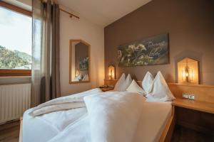 Posteľ alebo postele v izbe v ubytovaní Hotel Wildschütz