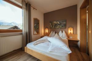 Posteľ alebo postele v izbe v ubytovaní Hotel Wildschütz