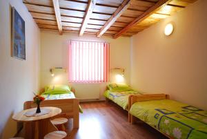 מיטה או מיטות בחדר ב-Privat Monika