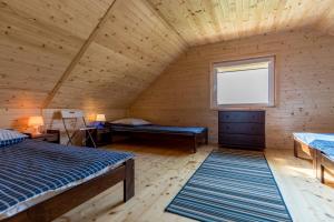 Postel nebo postele na pokoji v ubytování Domki Letniskowe Błękit