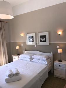 Ένα ή περισσότερα κρεβάτια σε δωμάτιο στο Paradisos Hotel