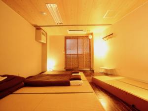 Postel nebo postele na pokoji v ubytování Osaka Guesthouse Nest