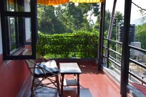 Un balcón o terraza en Siddhartha Garden Ayurveda