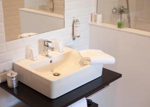 Koupelna v ubytování Hotel Balea