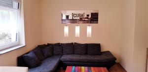 a living room with a couch in the corner at Apartment Hallstadt in Hallstadt