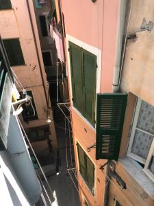 an overhead view of a building with green windows at MADA Charm Apartments Terrace&Carugio in Vernazza