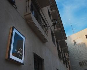 a sign on the side of a building at The Market Hostel in Alicante