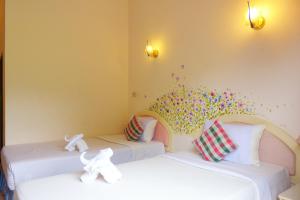Postel nebo postele na pokoji v ubytování Phurua Bussaba Resort & Spa