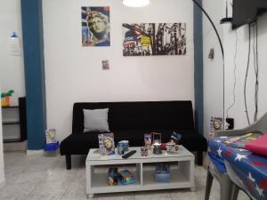 a living room with a couch and a table at Apollon Apartments H-1 H-2 in Rhodes Town