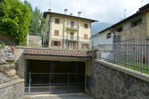 a large garage with a building in the background at CasaDellaMontagna in Dorga