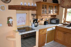 a kitchen with a sink and a stove top oven at Haus Martina in Siegsdorf +10 photos