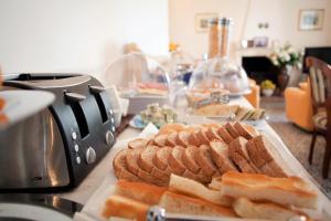 a table with a plate of bread and toast at Villa Margherita in Levanto
