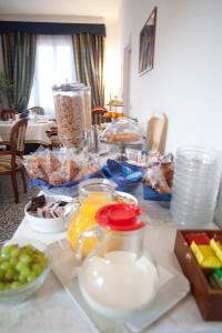 a table with a bunch of food on it at Villa Margherita in Levanto