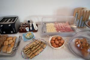 a table topped with trays of different types of food at Villa Margherita in Levanto