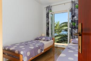 Posteľ alebo postele v izbe v ubytovaní Holiday Home Lučica