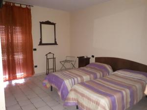 A bed or beds in a room at Lo Scoiattolo