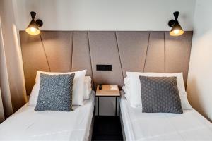 Posteľ alebo postele v izbe v ubytovaní GoldApartRooms