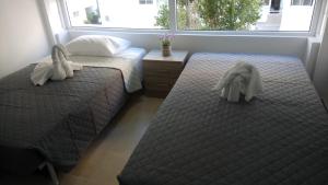 Un pat sau paturi într-o cameră la LCA4 flat for you apartment