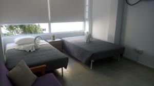 Un pat sau paturi într-o cameră la LCA4 flat for you apartment +39 fotografii